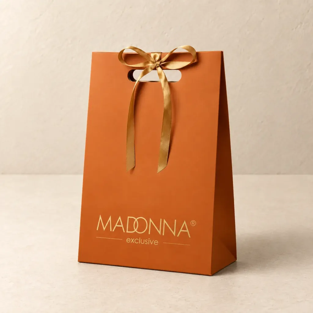 Pomarańczowa torba prezentowa R2 ze złotą kokardą, wyciętym uchwytem i nadrukiem Madonna